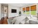 Main bedroom features hardwood floors and large windows with scenic views at 16004 Deer River Rd, Charlotte, NC 28278