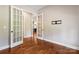 Office with hardwood floors and french doors with view to kitchen at 16004 Deer River Rd, Charlotte, NC 28278