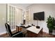 Bright office with modern desk, contemporary decor, and hardwood floors at 16004 Deer River Rd, Charlotte, NC 28278