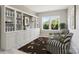 Charming sitting room with built-in bookshelves, comfortable chairs, and natural light at 16004 Deer River Rd, Charlotte, NC 28278