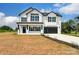 Two-story house with white brick, black shutters, and a black garage door at 1418 Malden Ct, Crouse, NC 28033