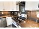 Stainless steel range and dark countertop in modern kitchen at 1418 Malden Ct, Crouse, NC 28033