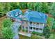 Stunning aerial view of the property showcasing the brick home and two car detached garage at 5888 Hidden Oaks Ln, Clover, SC 29710