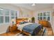 Cozy bedroom with wood floors and bright natural light at 5888 Hidden Oaks Ln, Clover, SC 29710