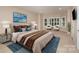 Comfortable bedroom with a large bed, seating area, and natural light at 5888 Hidden Oaks Ln, Clover, SC 29710