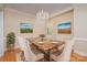 Elegant dining room with chandelier, hardwood floors, and seating for eight at 5888 Hidden Oaks Ln, Clover, SC 29710