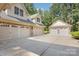 Spacious driveway with multiple attached and detached garages offer ample parking and storage at 5888 Hidden Oaks Ln, Clover, SC 29710