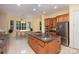 Spacious kitchen with granite countertops, stainless steel appliances, and light yellow walls at 5888 Hidden Oaks Ln, Clover, SC 29710