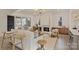 Cozy living room featuring a fireplace, built-in shelving, and large windows at 4839 Fairheath Rd, Charlotte, NC 28210