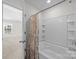 Clean bathroom with a shower/tub combo and floral shower curtain at 181 Atwater Landing Dr, Mooresville, NC 28117