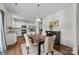 Kitchen and dining area with hardwood floors, and a view to backyard at 181 Atwater Landing Dr, Mooresville, NC 28117