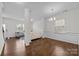 Bright dining room with hardwood floors and elegant chandelier at 181 Atwater Landing Dr, Mooresville, NC 28117