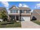 Two-story house with stone accents and a two-car garage at 181 Atwater Landing Dr, Mooresville, NC 28117