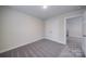 Neutral bedroom with gray carpet and an open doorway to another room at 22 Porter Nw St # Sw22, Concord, NC 28027