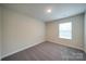 Neutral bedroom with carpet, natural light from the window, and white trim at 22 Porter Nw St # Sw22, Concord, NC 28027