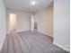 Bedroom with gray carpet and a closet with an open door at 22 Porter Nw St # Sw22, Concord, NC 28027