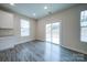 Bright dining area features sliding glass doors and wood floors at 22 Porter Nw St # Sw22, Concord, NC 28027