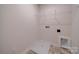 Laundry room with vinyl floor, hookups, a wire rack, and white trim at 22 Porter Nw St # Sw22, Concord, NC 28027