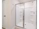 Enclosed walk-in shower featuring modern fixtures and shelving at 22 Porter Nw St # Sw22, Concord, NC 28027