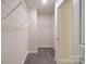 Well-organized walk-in closet featuring carpet and wire shelves at 22 Porter Nw St # Sw22, Concord, NC 28027