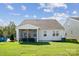 Exterior view of a home showcasing a well-maintained lawn and screened-in back porch at 888 Exeter Dr, Sherrills Ford, NC 28673