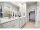 Well-lit bathroom features double sinks, a large mirror, and a walk-in shower at 888 Exeter Dr, Sherrills Ford, NC 28673