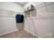 Organized walk-in closet equipped with shelving and hanging space for efficient storage at 888 Exeter Dr, Sherrills Ford, NC 28673