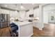 Modern kitchen featuring white cabinets, stainless steel appliances, and a large island at 888 Exeter Dr, Sherrills Ford, NC 28673