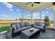 Comfortable screened-in porch featuring plush seating and views of the surrounding landscape at 888 Exeter Dr, Sherrills Ford, NC 28673