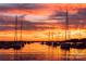 Vibrant sunset over a harbor filled with sailboats, reflecting on the calm water at 888 Exeter Dr, Sherrills Ford, NC 28673