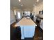 White kitchen island with seating and a large countertop at 546 Amalfi Dr, Davidson, NC 28036