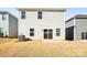 Rear view of house showcasing sliding glass doors and small yard at 1236 31St St, Hickory, NC 28613