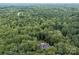 House nestled in a large wooded lot at 4364 Hager Mountain Ln, Iron Station, NC 28080