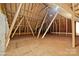 Spacious attic with unfinished wood framing and flooring at 4364 Hager Mountain Ln, Iron Station, NC 28080