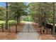 Ornate iron gates open to a private driveway at 4364 Hager Mountain Ln, Iron Station, NC 28080