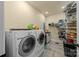 Bright laundry room, features washer, dryer and ample storage at 4364 Hager Mountain Ln, Iron Station, NC 28080