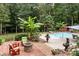 Brick patio with fire pit and comfortable seating area at 4364 Hager Mountain Ln, Iron Station, NC 28080