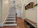 Elegant staircase with wood risers and white painted balustrade at 4364 Hager Mountain Ln, Iron Station, NC 28080