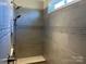 Modern bathroom with tiled shower, a built-in bench, and a handheld shower head at 5106 Silver Trace Ln # 90, Denver, NC 28037