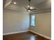 Bright bedroom with hardwood floors, a ceiling fan, tray ceiling, and natural light from a window at 5106 Silver Trace Ln # 90, Denver, NC 28037