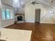 Spacious living room with beautiful hardwood floors and a stone fireplace at 5106 Silver Trace Ln # 90, Denver, NC 28037