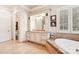 Spa-like bathroom with a soaking tub and vanity at 7025 Willow Trace Ln, Weddington, NC 28104