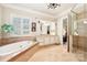 Bathroom with soaking tub, double vanity and glass shower at 7025 Willow Trace Ln, Weddington, NC 28104