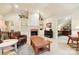 Comfortable bonus room with a fireplace and built-in shelving at 7025 Willow Trace Ln, Weddington, NC 28104