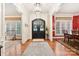 Two story foyer with hardwood floors and elegant chandelier at 7025 Willow Trace Ln, Weddington, NC 28104