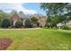 Attractive brick home with manicured landscaping at 7025 Willow Trace Ln, Weddington, NC 28104