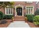 Elegant entryway with double doors and seasonal decorations at 7025 Willow Trace Ln, Weddington, NC 28104