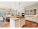 Gourmet kitchen with island and breakfast area at 7025 Willow Trace Ln, Weddington, NC 28104