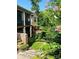 Brick home with a screened porch, deck, and stone steps leading to a landscaped backyard at 90 Silver Trace Ln # 90, Denver, NC 28037