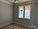 Bedroom with hardwood floors and a large window at 94 Sterling Branch Loop # 94, Denver, NC 28037